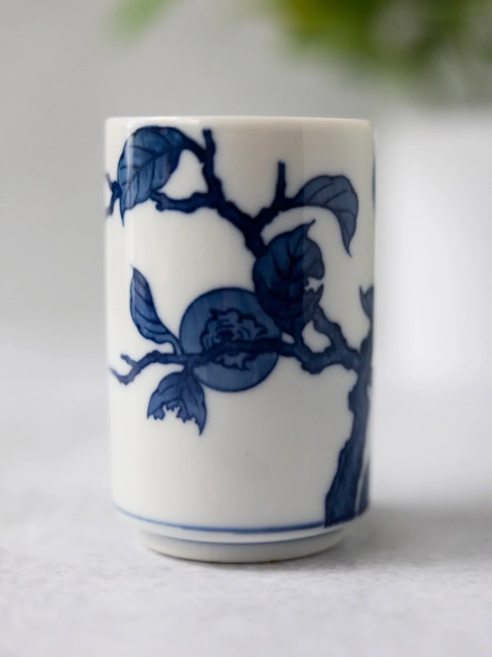 Vintage Otagiri blue white ceramic persimmon tea cup or small vase 3 3/8